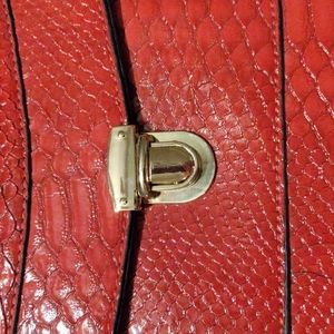 Gorgeous red purse with adjustable goldtone metal chain